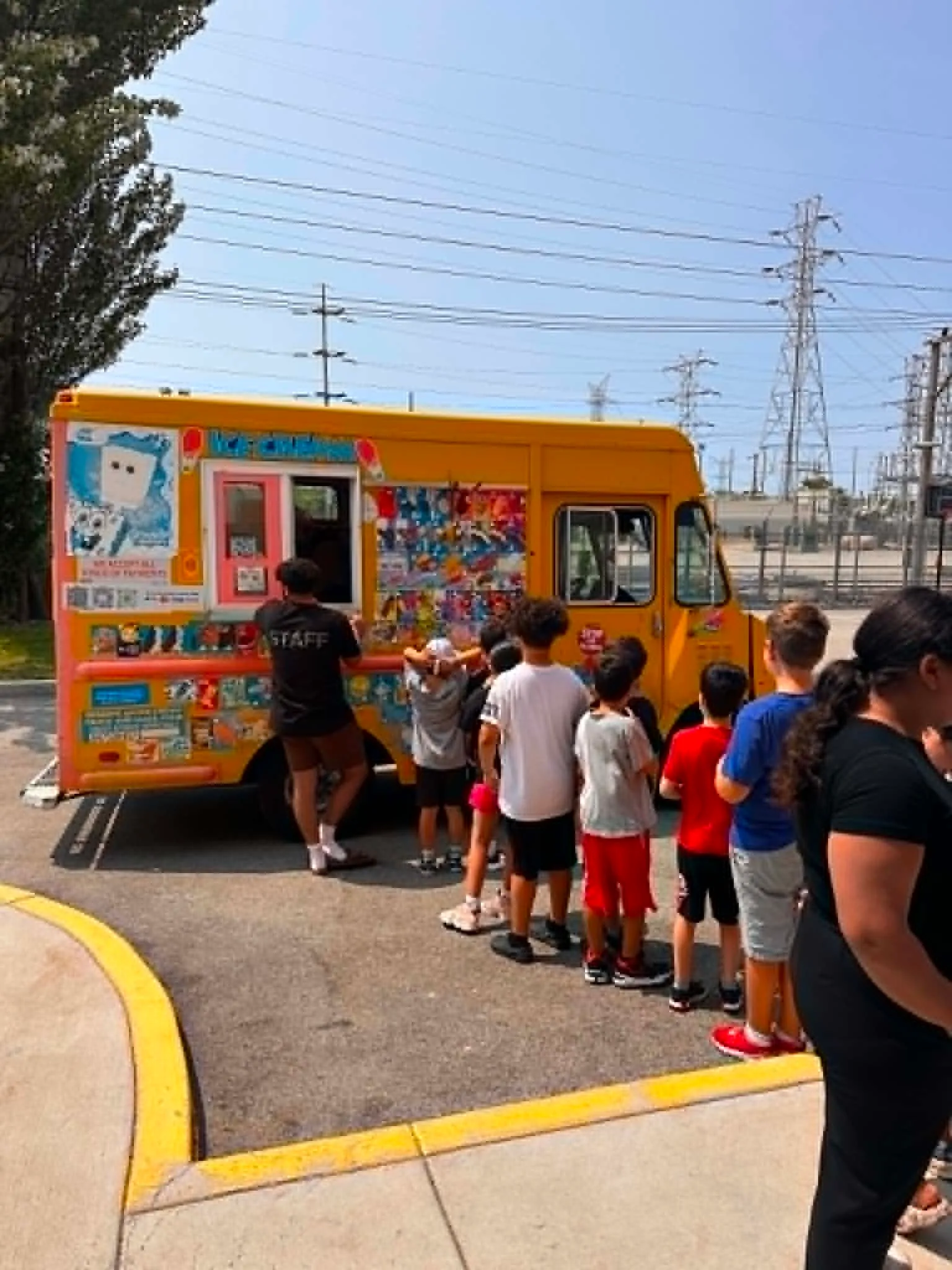 Students lining up for ice cream at a school event