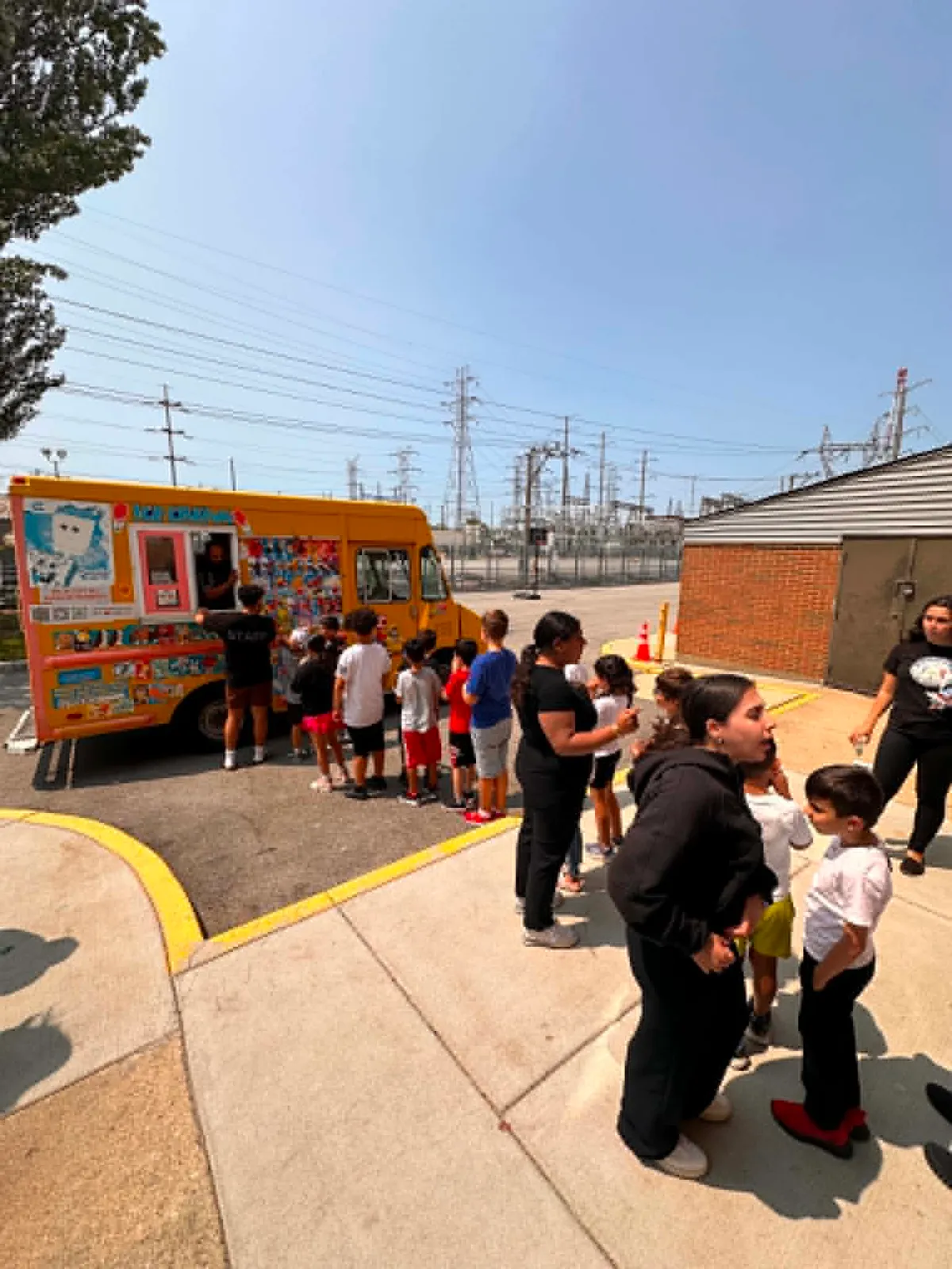 Children waiting their turn at the ice cream truck window